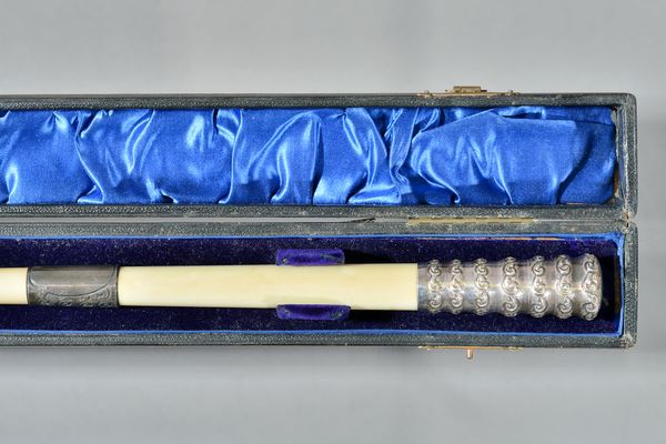 An ivory and silver mounted conductor's baton, hallmarked Birmingham 1847 and London 1898, of circular tapering form in a velvet lined leather case, t