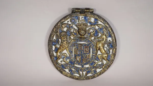 A Charles II gilt bronze and enamel circular Royal Coat of Arms panel, in the manner of Anthony Hatch and Stephen Pilcherd, circa 1675, raised in reli