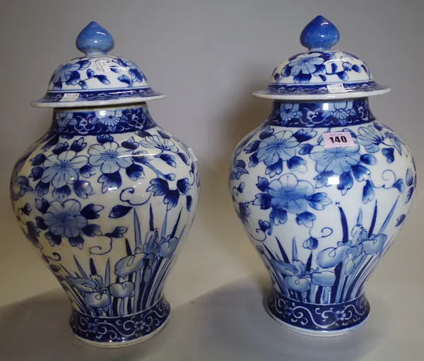 A pair of Asian blue and white large lidded vases, (2).