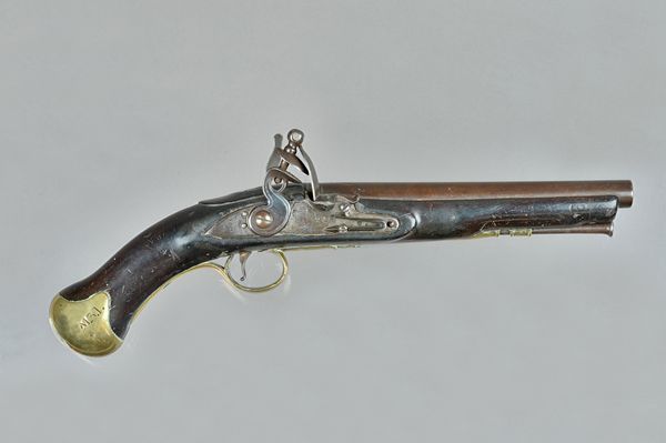 An East India Company flintlock pistol dated 1808, with circular steel barrel, 23cm, lion engraved lockplate stamped '1808' brass trigger guard and po