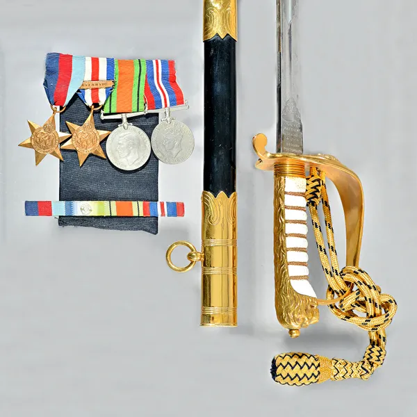 An officer's ceremonial sword, by Gieve Matthews and Seagrove Ltd, London & Portsmouth, with a slightly curved polished steel blade, 79.5cm, brass fol