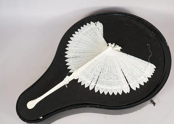 A Cantonese ivory cockade fan, late 19th century, ornately carved and pierced with foliate cartouches, the navette tips carved with animals, cased, (a