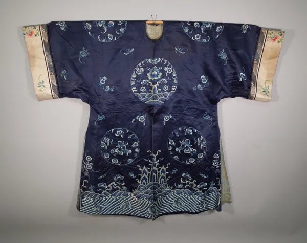 A Chinese silk blue ground robe with all over foliate decoration.