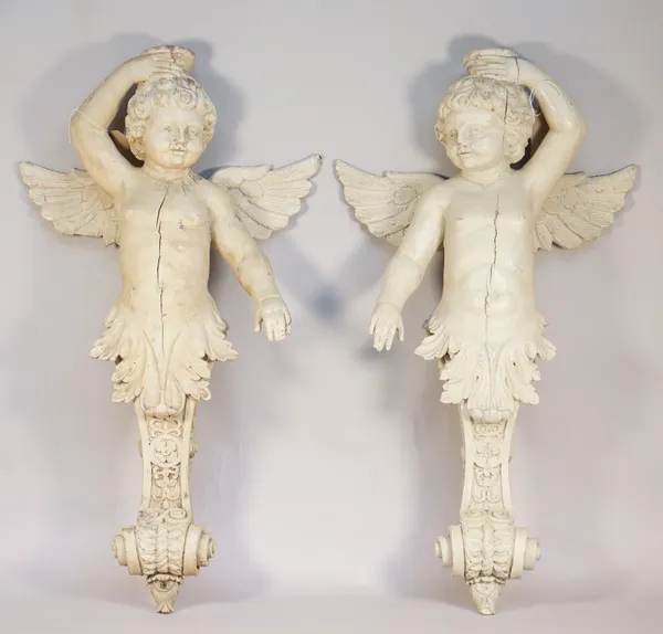 A pair of carved wood and gesso figural corbels, 19th century, each detailed with a beige painted winged cherub over a foliate carved backplate, 78cm