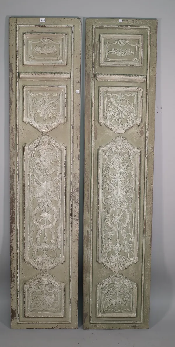 A pair of painted sheet metal panels, late 19th century style, each relief cast with foliate decoration over four distinct sections and painted distre