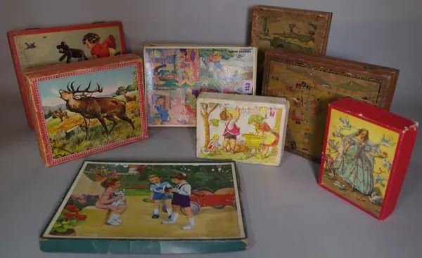 Toys comprising; a quantity of mid-20th century vintage puzzles and building blocks, (qty).