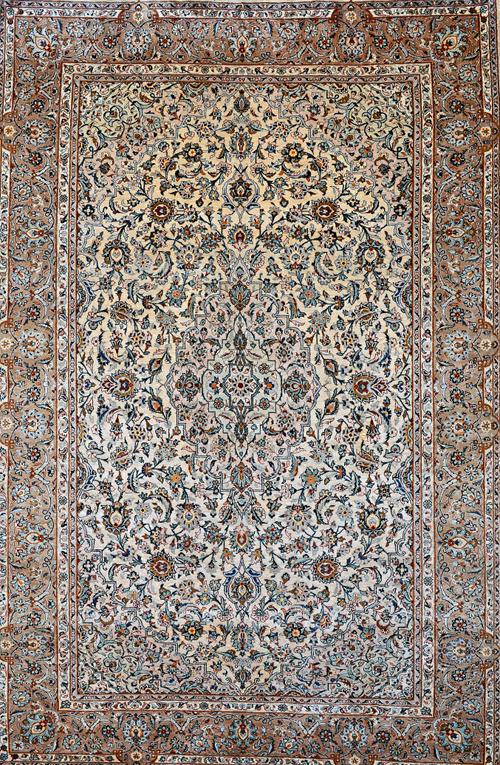A fine silk Ghom rug, Persian, the ivory field with a central medallion, matching spandrels, all with delicate floral vines, a brown palmette and vine