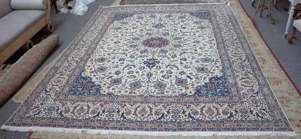 A part silk Nain carpet Persian, the ivory field with an indigo tear drop medallion, pale indigo spandrels, all with delicate floral vines, an ivory c