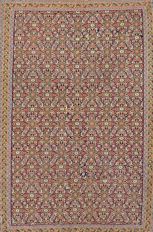 A fine Senneh gelim, Persian, the black field with an allover herate pattern, a saffron trailing floral border, 190cm x 124cm. Illustrated