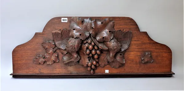 A 19th century German oak carving depicting two ho ho birds amongst fruiting vines, 87cm wide x 31cm high.