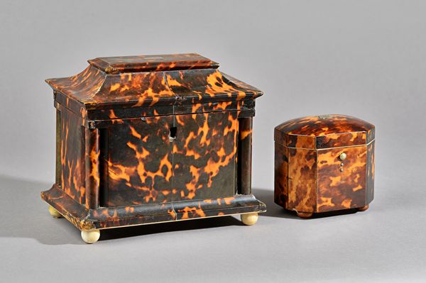 A Regency tortoiseshell tea caddy, the swept rectangular top enclosing a twin lidded interior, 20cm wide x 18cm high, and a George III tortoiseshell s