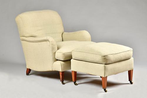 Howard & Sons; an easy armchair with downswept and shaped side frieze on tapering square mahogany supports, 73cm wide x 88cm high together with a matc