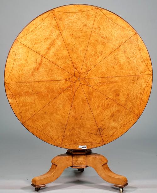 J.J. Werner; a 19th century French figured oak occasional table, the circular snap top on baluster hexagonal column and three downswept supports, 92cm