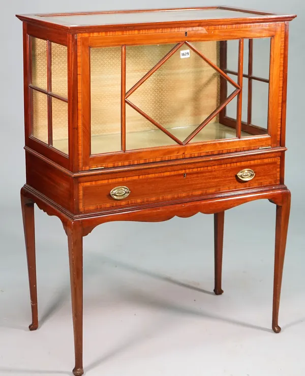 An Edwardian satinwood banded mahogany display cabinet, with astragal glazed fall front over frieze drawer on club supports, 78cm wide x 108cm high.