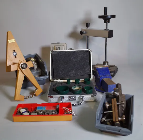 Horological interest; a quantity of watchmaker's tools, mainly clamps, brackets and sundry, (qty).