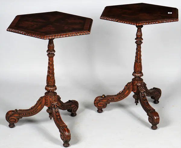 Maitland-Smith Ltd; a pair of 18th century style occasional tables, each with radial veneered hexagonal mahogany tops on floral carved tripod bases, 5