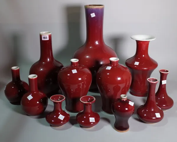 Asian ceramics, a quantity of 20th century red glazed vases of various forms, the largest 42cm high.