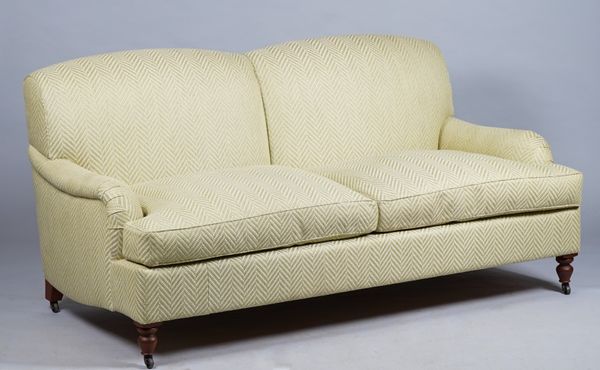 Kingcome Sofas; a modern green upholstered double hump back sofa on turned supports, 187cm wide x 90cm high.