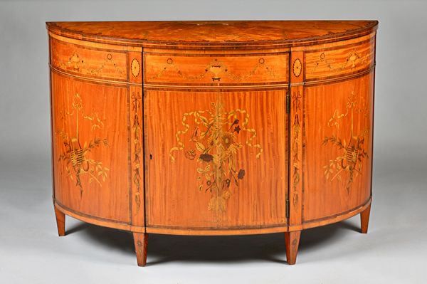 A George III style floral marquetry inlaid satinwood and mahogany demilune commode, with single door, on tapering square supports, 122cm wide x 81cm h