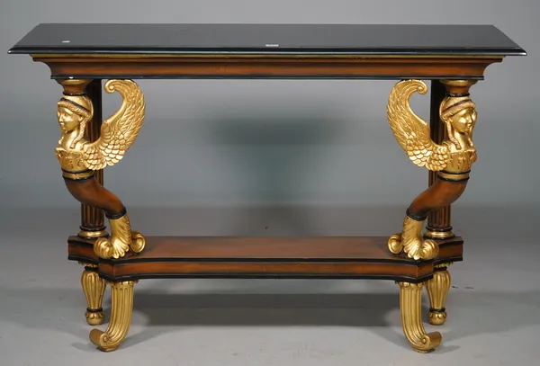 An Empire style console table, the rectangular marble top on a pair of parcel gilt winged caryatids united by concave platform on cornucopia feet, 130