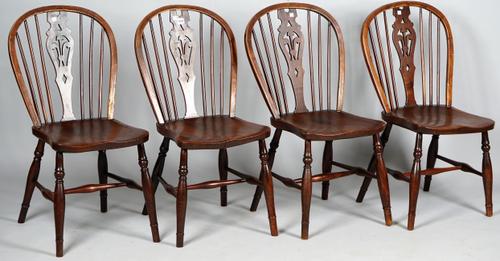 A set of four 19th century ash and elm splat back chairs on turned supports and stretchers, 40cm wide x 87cm high.