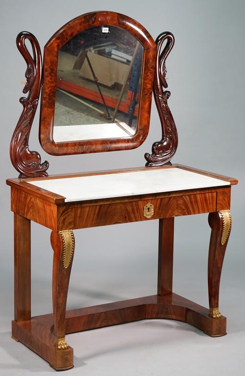 An Empire Revival ormolu-mounted mahogany dressing table, the swing mirror on swan and dolphin supports over marble top and single drawer, 102cm wide