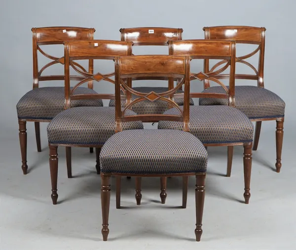 A set of six George III mahogany dining chairs with 'X' frame splat and bow seat on turned supports, 50cm wide x 82cm high. (6).