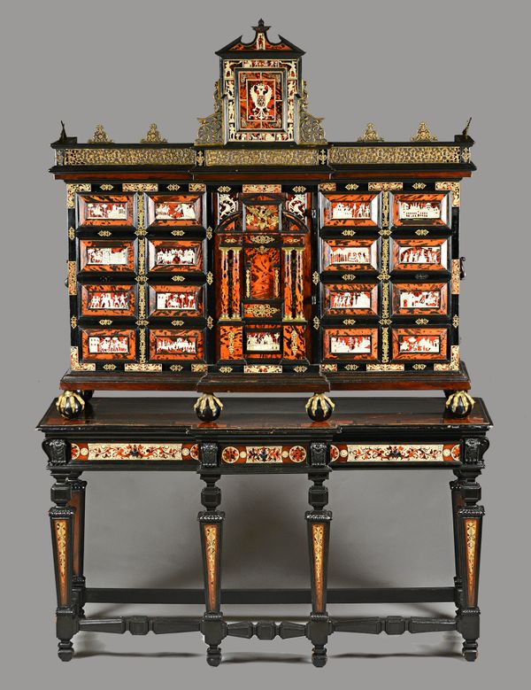 A late 19th century South German gilt metal mounted ivory, tortoiseshell, rosewood and ebonised cabinet on stand, the pierced breakfront frieze over a