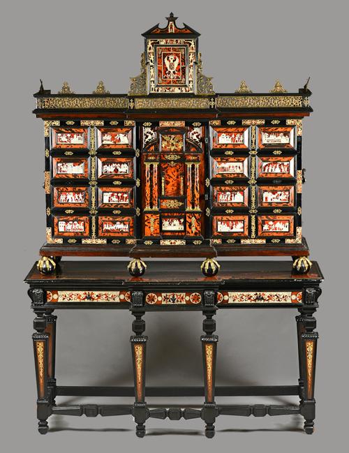 A late 19th century South German gilt metal mounted ivory, tortoiseshell, rosewood and ebonised cabinet on stand, the pierced breakfront frieze over a