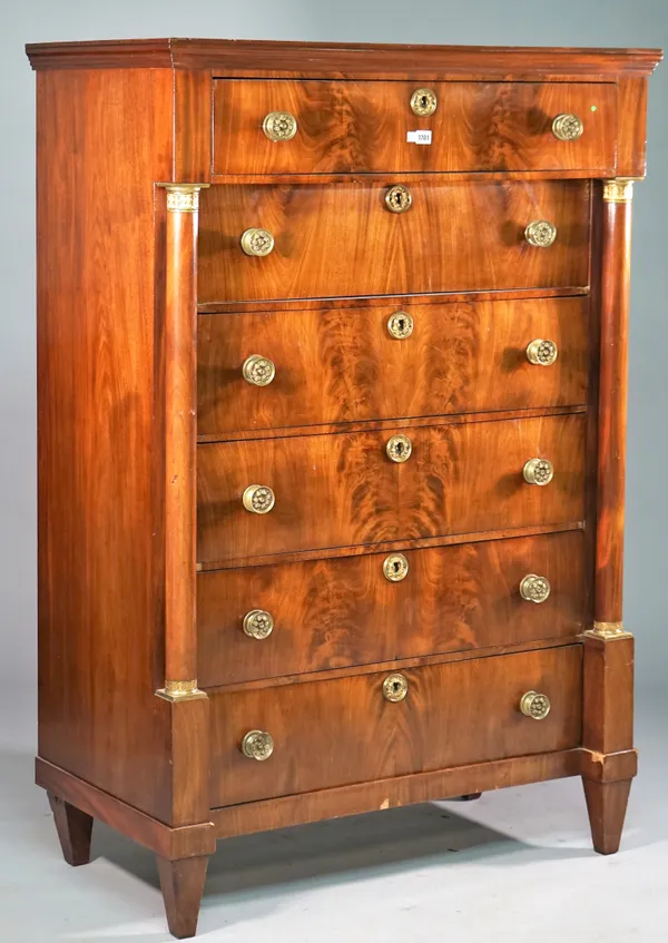 A 19th century French gilt-metal mounted marble topped mahogany tall chest of six drawers flanked by turned columns, 104cm wide x 154cm high.