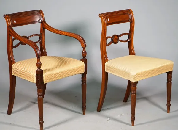 A set of eight George IV mahogany dining chairs with double pierced waist rail on turned supports, including a pair of carvers, (8).