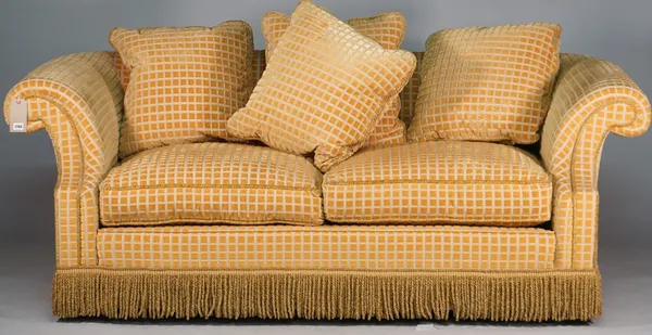 A modern yellow square check upholstered sofa with roll over arms and tassel frieze, 210cm wide x 78cm high.