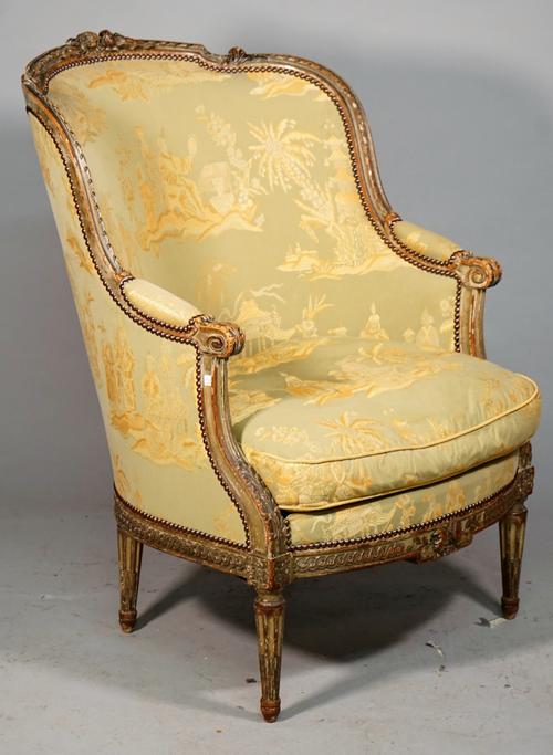 A Louis XVI style tub back armchair with foliate carved green painted frame on tapering fluted supports, 19th century, 73cm wide x 102cm high.