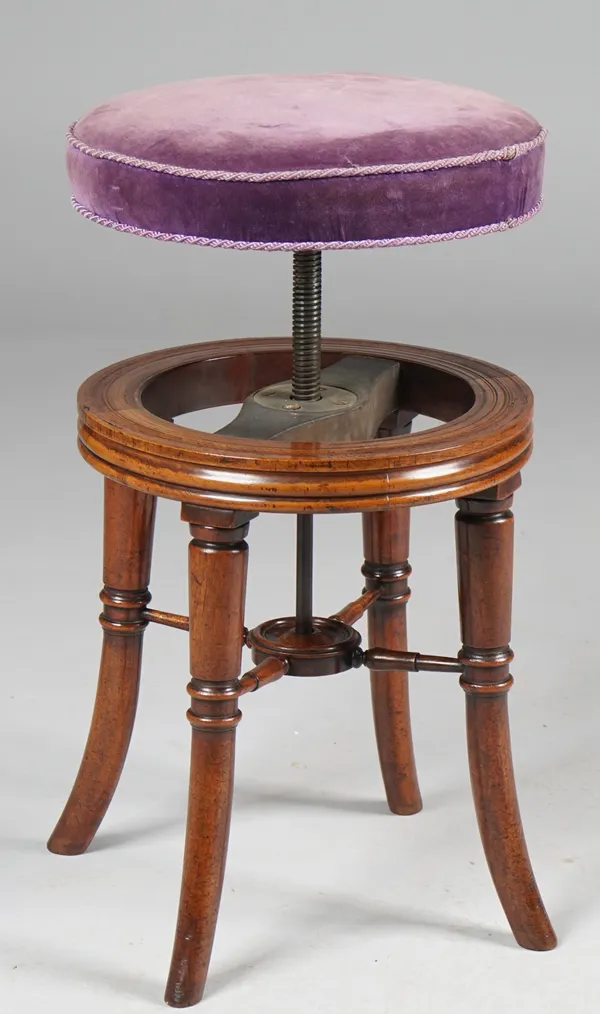 A Regency mahogany piano stool, the circular height adjustable top on four splayed turned supports, 38cm diameter x 49cm high, (lowest).