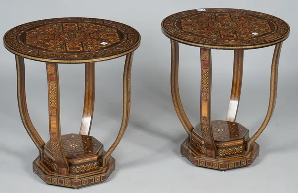 A pair of modern Moorish revival circular occasional tables, each with four shaped supports resting on stepped octagonal platform, 44cm deep x 55cm hi