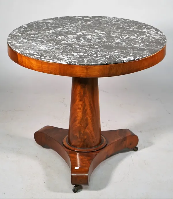 An early 19th century French gueridon, the circular marble top on turned mahogany column and three downswept supports, 78cm diameter x 69cm high.