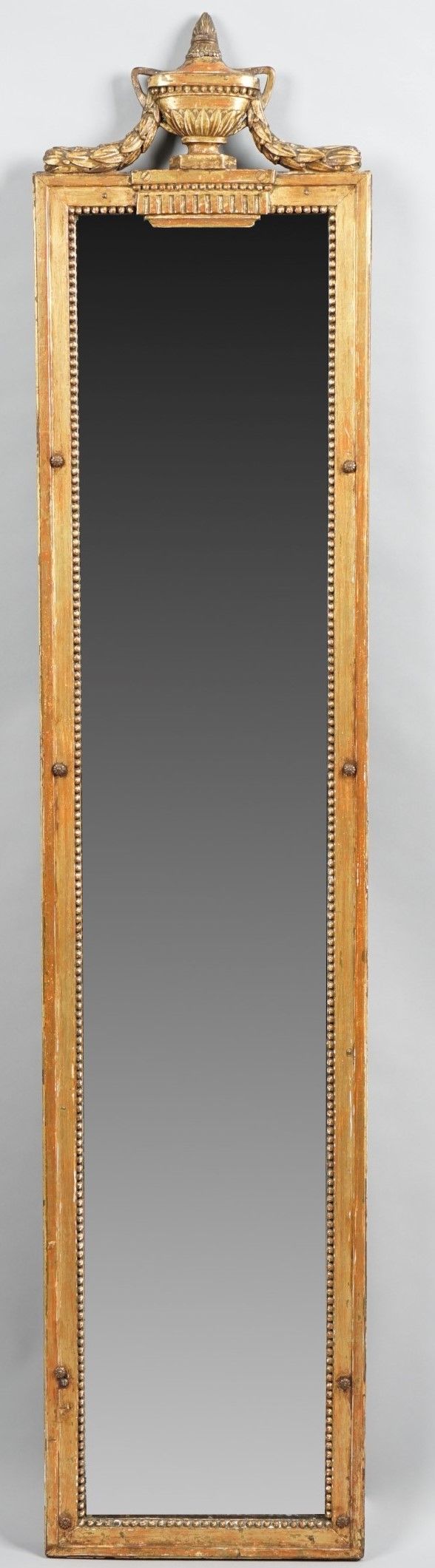 A 19th century gilt framed pier mirror with urn crest over moulded frame, 33cm wide x 157cm high.