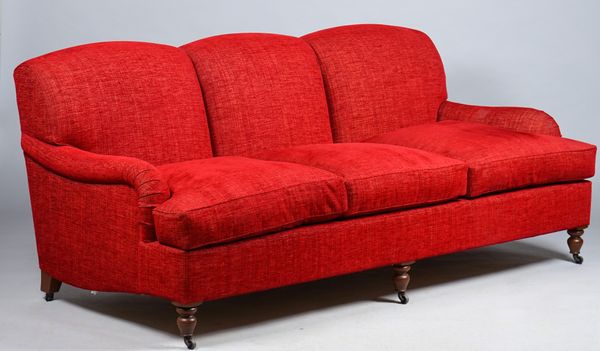 Kingcome Sofas; a modern red upholstered triple hump back sofa on turned supports, 202cm wide x 90cm high.