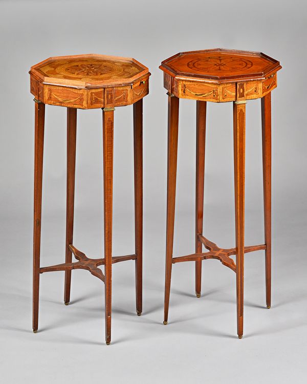 A pair of George III style occasional tables, circa 1900, each with inlaid octagonal top over candle slide on tapering square supports, united by shap