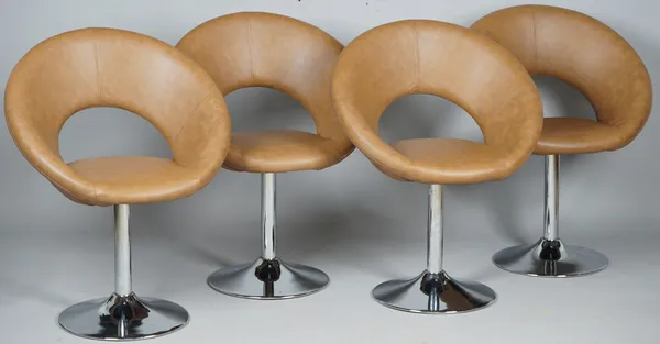 Retro design; a set of four tan leatherette upholstered swivel easy chairs with hoop backs and splayed polish metal supports, 69cm wide x 85cm high.