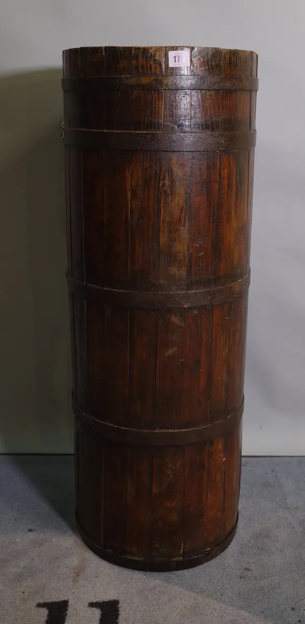 An early 20th century pitch pine and iron bound stick stand of cylindrical form, 32cm diameter x 88cm high.