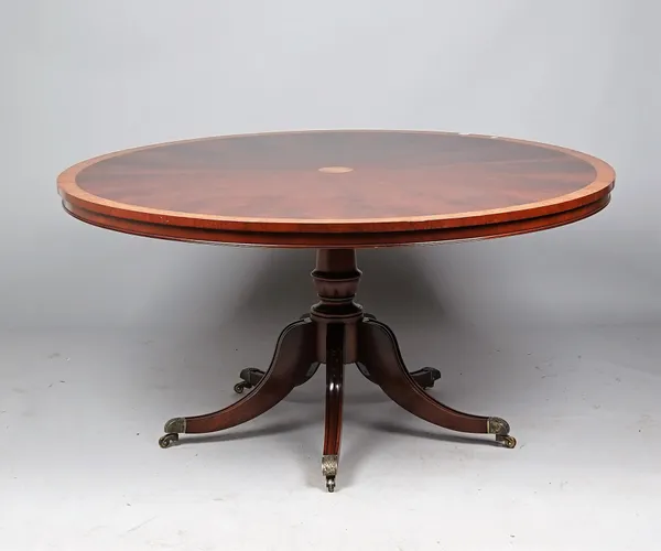 Arthur Brett; a George III style supper table, the stella veneererd burr walnut banded circular top on five downswept supports, 152cm diameter x 75cm