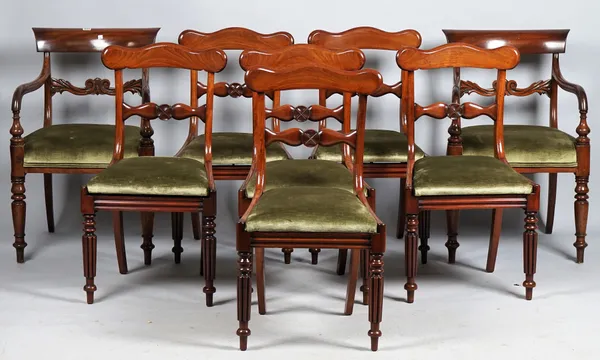 A matched set of eight Regency mahogany dining chairs, each with concave crest rail and carved waist on reeded supports, six single chairs and two sim