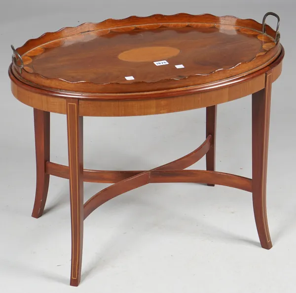 A George III satinwood inlaid mahogany oval serving tray with wavy gallery on later stand, 69cm wide x 58cm high.