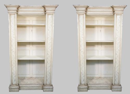 A pair of distressed white painted floor standing breakfront open bookcases, each on plinth base, 120cm wide x 210cm high, (2).