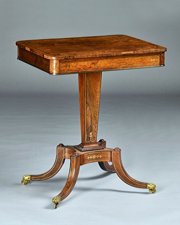 A Regency brass inlaid rosewood occasional table, the rounded rectangular top with single frieze drawer on tapering square column and four downswept s