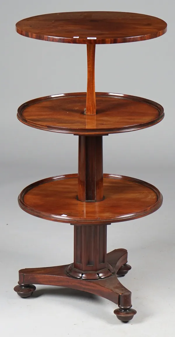 A William IV metamorphic mahogany circular three tier dumb waiter on triangular platform, 56cm diameter x 79cm closed, 109cm high open.