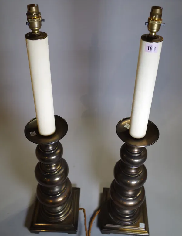 A pair of 20th century bronzed metal table lamps of turned form, 83cm high, (2).