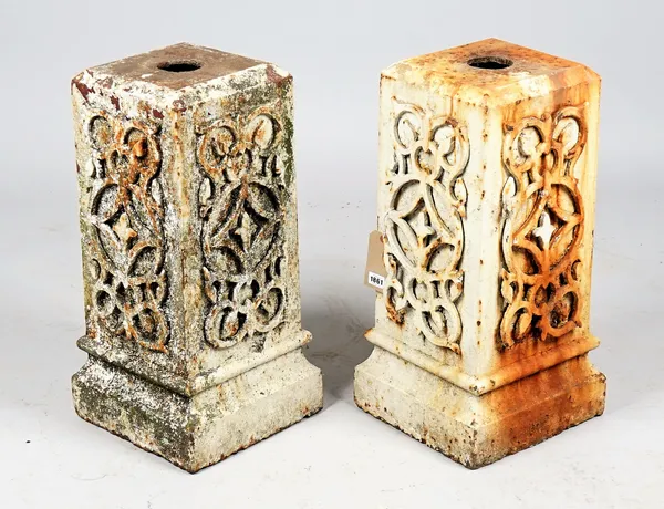 A pair of white painted wrought iron pedestals, with relief wriggle work mounts, 30cm wide x 62cm high.