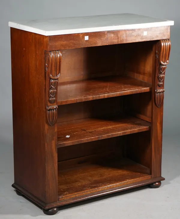 A William IV dwarf bookcase, the rectangular white marble top over a mahogany open base with a pair of adjustable shelves, flanked by scroll brackets,